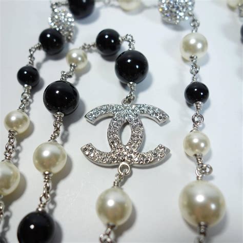 chanel black white pearl necklace|Chanel long necklace with logo.